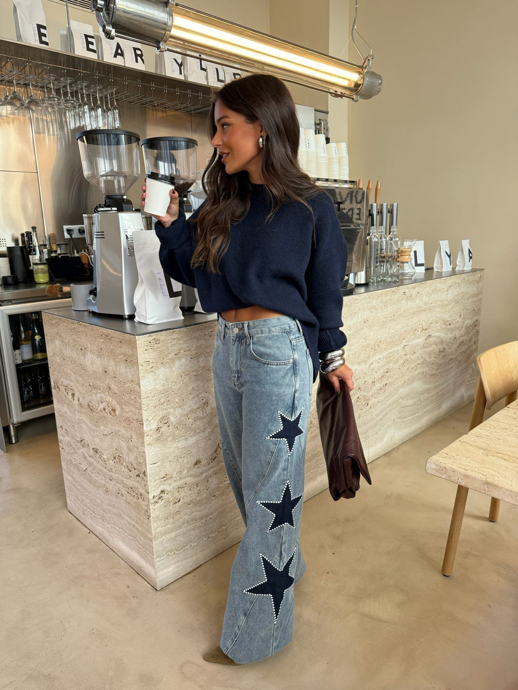 Calças de denim com estrela preta